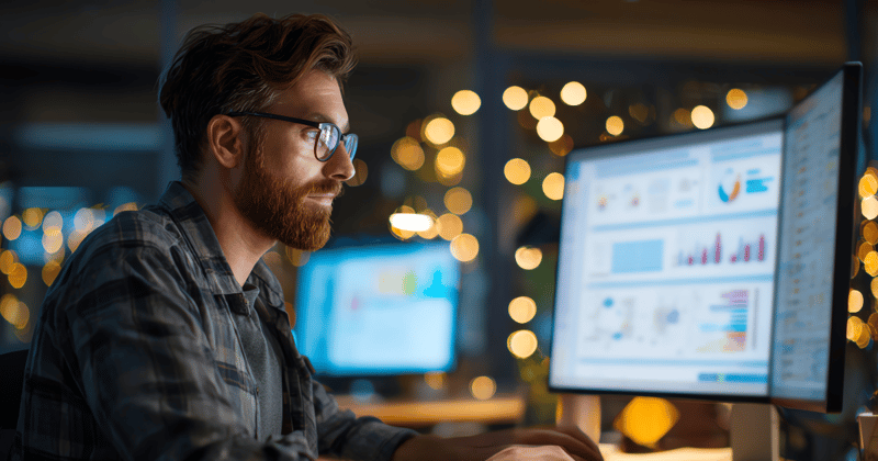 IT Professional at his desk with screens