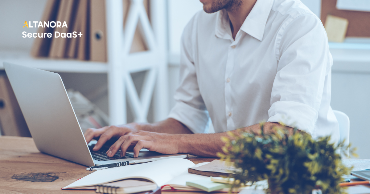altanora secure daas - employee at laptop in office
